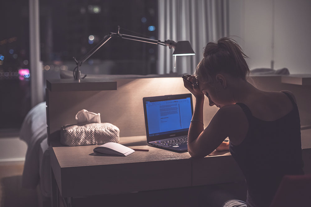 woman staying up late from insomnia